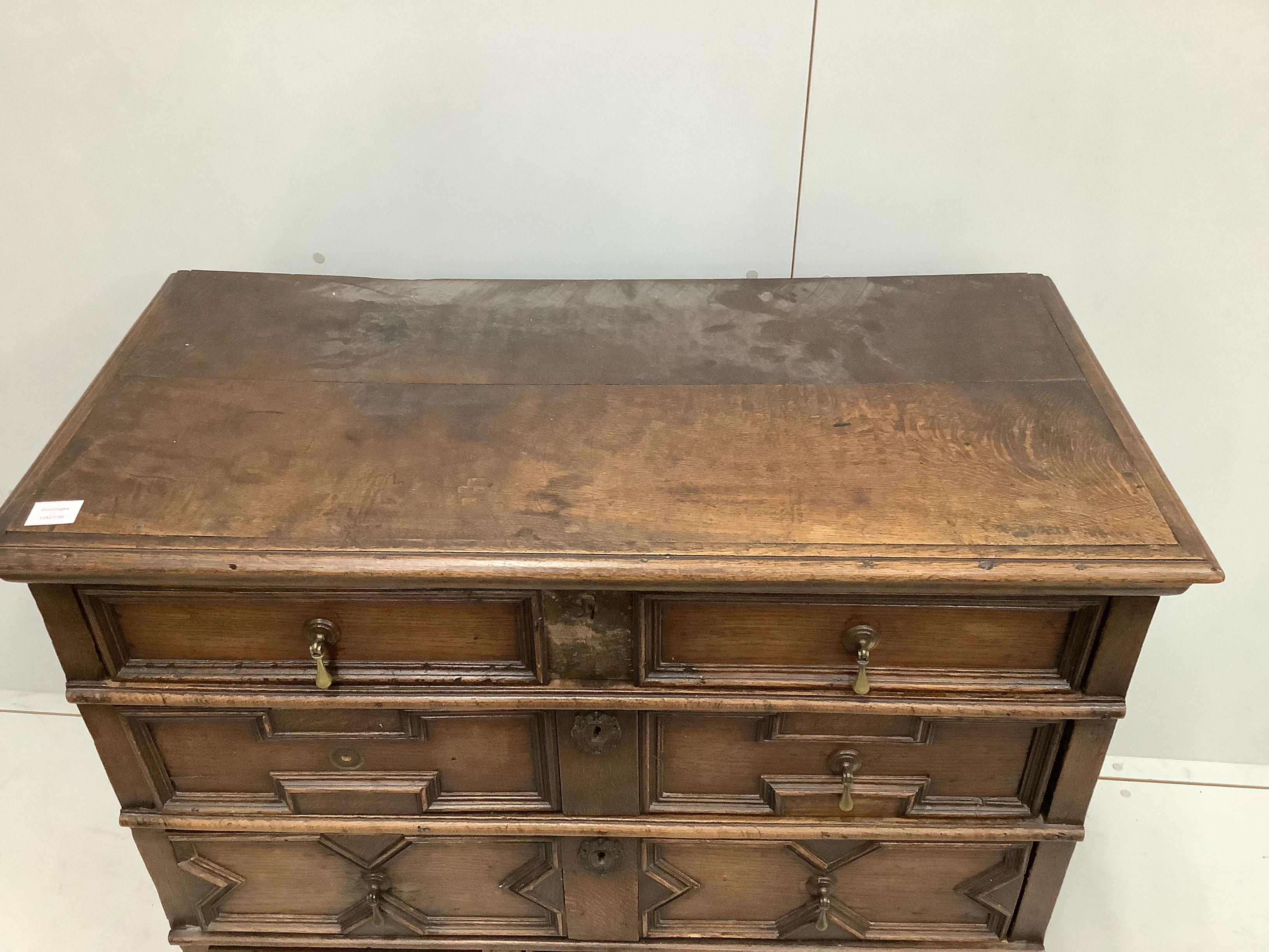 A 17th century Jacobean oak chest of four drawers, width 102cm, depth 51cm, height 97cm